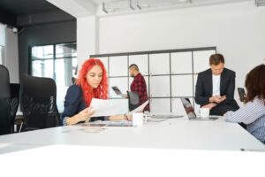 Advertising agency staff doing their work in comfortable bright office